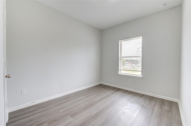 spare room with light hardwood / wood-style floors