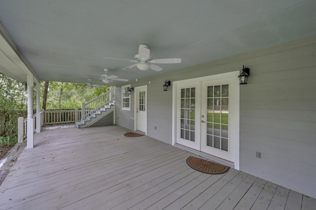 wooden deck with stairs, a ceiling fan, and french doors