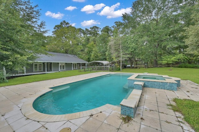 view of pool featuring an outbuilding, an in ground hot tub, and a lawn