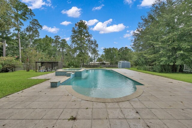 view of swimming pool featuring an in ground hot tub, a patio, a shed, and a lawn