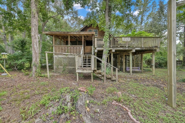 back of house featuring a deck