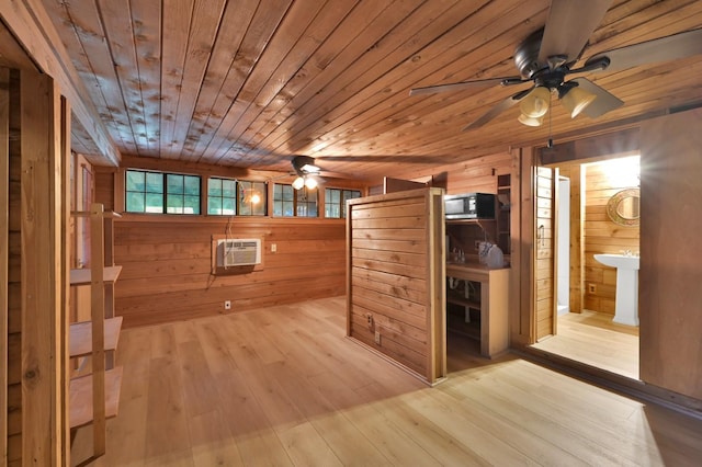 interior space with sink and a wall mounted air conditioner