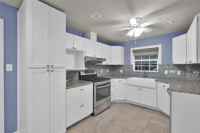 kitchen featuring a sink, tasteful backsplash, stainless steel range with gas cooktop, and under cabinet range hood