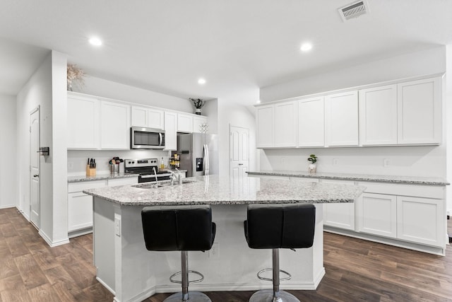 kitchen with white cabinetry and stainless steel appliances