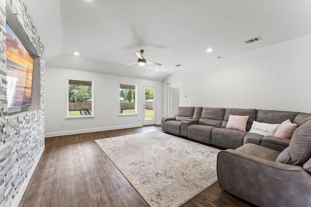 living room featuring vaulted ceiling, ceiling fan, and dark hardwood / wood-style floors