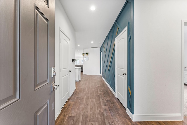 hall with dark wood-type flooring