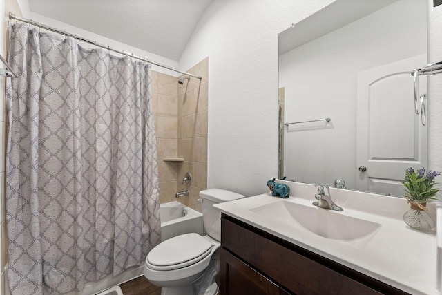 full bathroom with toilet, vanity, shower / bath combo, and vaulted ceiling