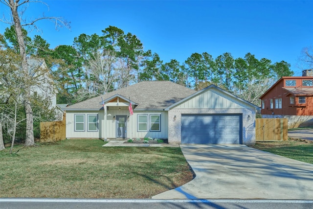 view of front of home with a front lawn and a garage