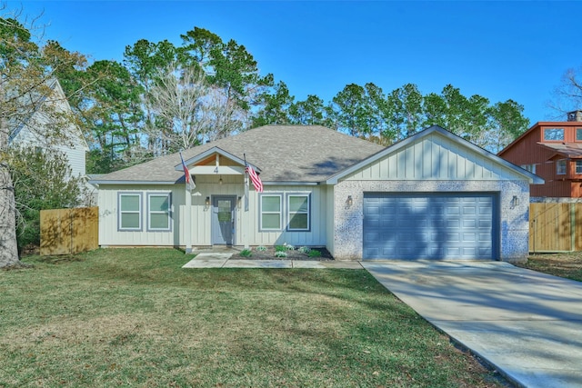 view of front of home with a garage and a front yard