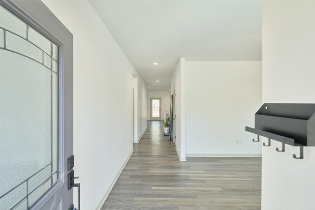 corridor featuring light hardwood / wood-style flooring