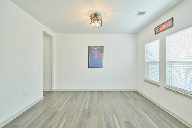 spare room featuring light hardwood / wood-style floors