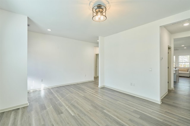 unfurnished room with light wood-type flooring