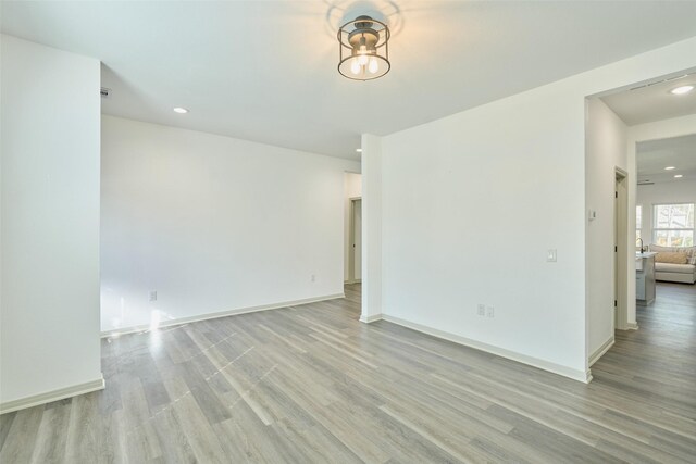 spare room with light hardwood / wood-style flooring