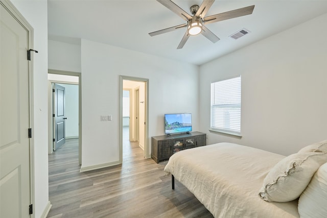 bedroom featuring hardwood / wood-style floors and ceiling fan