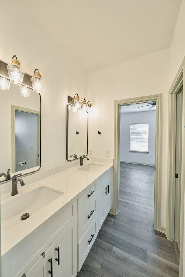 bathroom featuring vanity and hardwood / wood-style floors