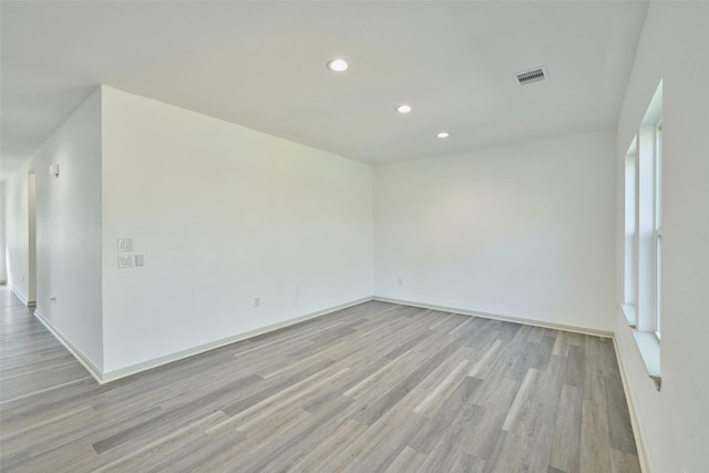 spare room featuring light hardwood / wood-style floors