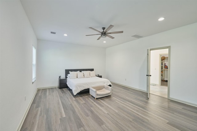 bedroom with light wood-type flooring and ceiling fan