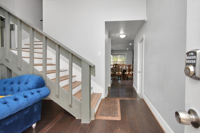 stairs featuring wood-type flooring