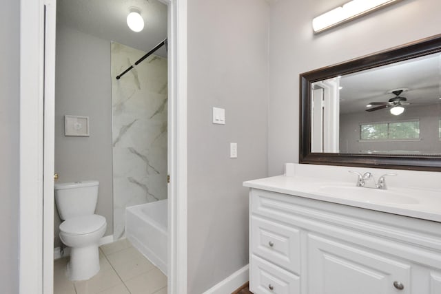 full bathroom featuring tiled shower / bath, tile patterned flooring, vanity, ceiling fan, and toilet