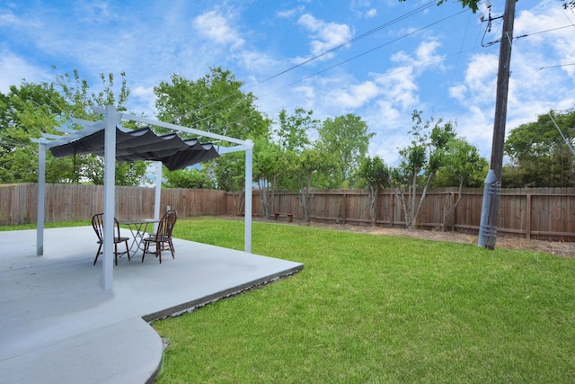 view of yard with a pergola and a patio area