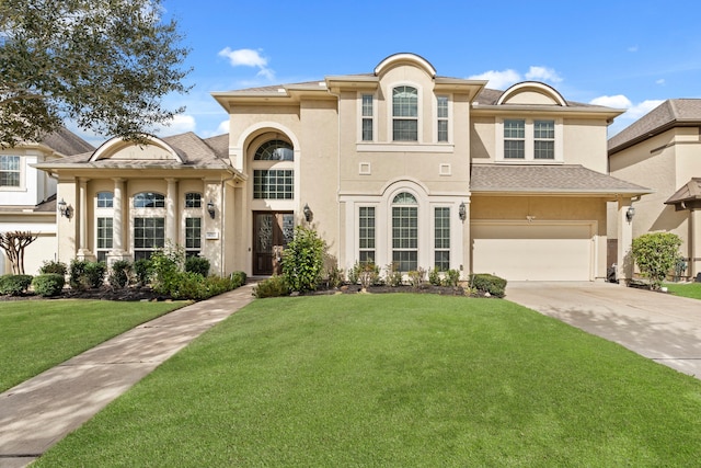 view of front facade featuring a garage and a front lawn