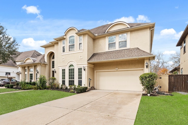 view of front of home with a garage and a front yard