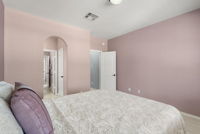 bedroom with light colored carpet