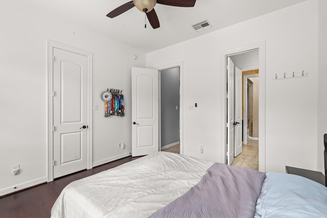 bedroom with hardwood / wood-style floors and ceiling fan