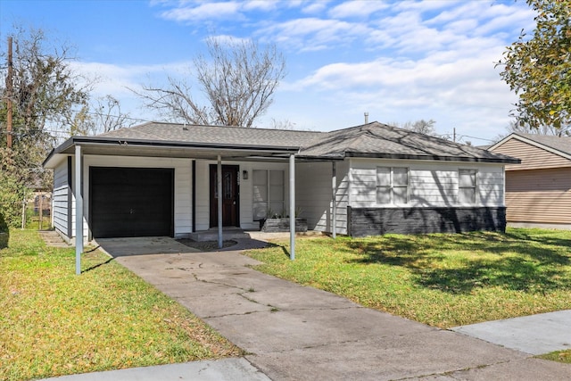 ranch-style home featuring a front yard and a garage