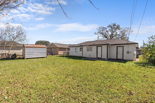 rear view of house with a yard