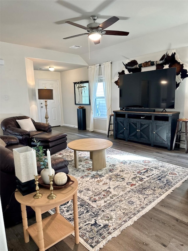 living room with ceiling fan and hardwood / wood-style floors