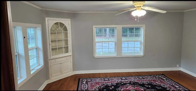 unfurnished dining area with a healthy amount of sunlight, ornamental molding, and wood-type flooring