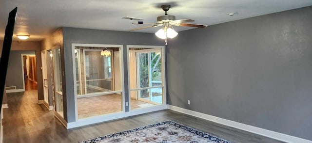 doorway to outside featuring hardwood / wood-style flooring and ceiling fan