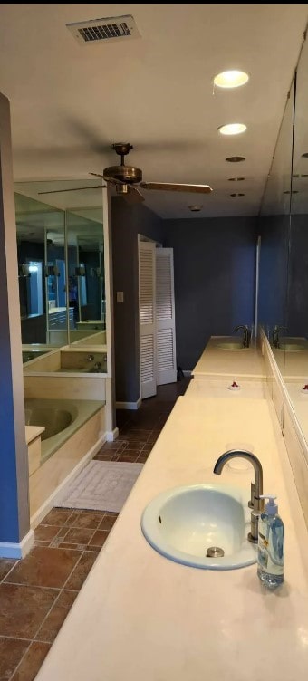 bathroom with vanity and a bathing tub