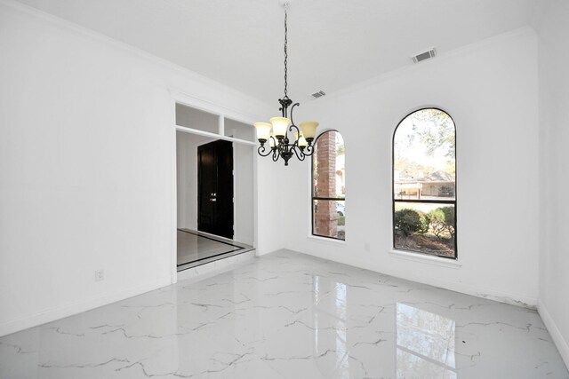 unfurnished dining area with a notable chandelier and ornamental molding