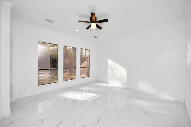 unfurnished room with ceiling fan