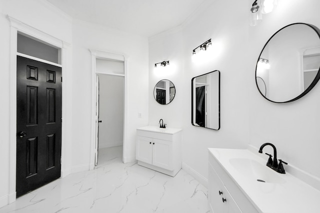 bathroom with crown molding and vanity