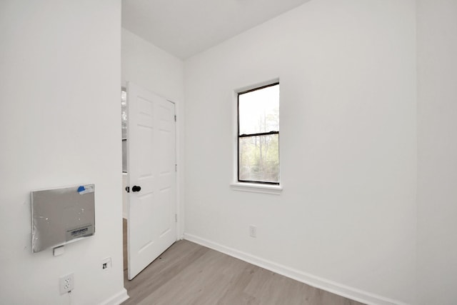 unfurnished room with light hardwood / wood-style floors