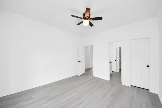 unfurnished bedroom with ceiling fan, ornamental molding, and light hardwood / wood-style floors