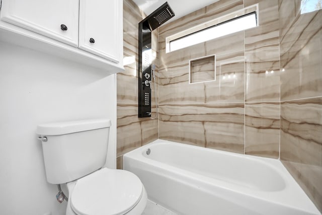 bathroom with tiled shower / bath and toilet