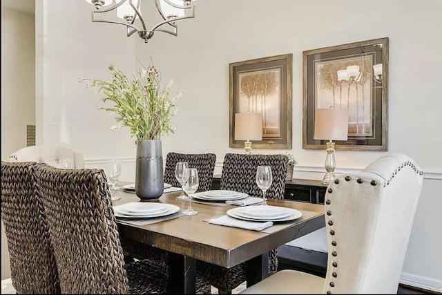 dining space with an inviting chandelier