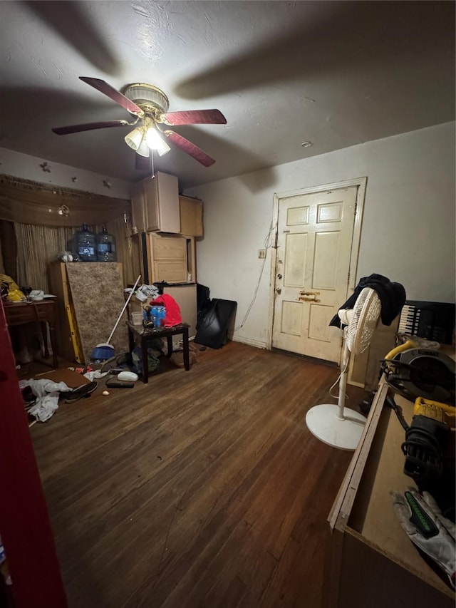 interior space with ceiling fan and dark hardwood / wood-style flooring