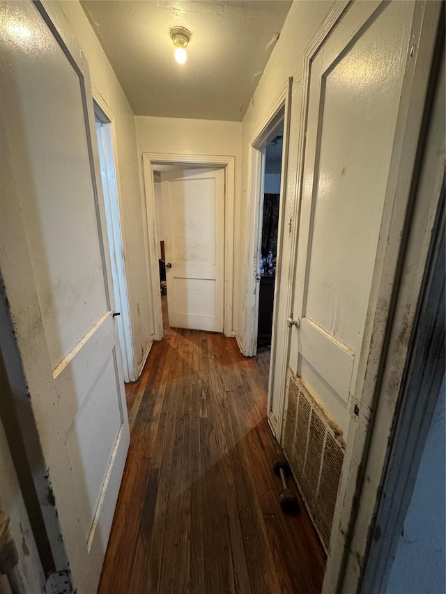 hallway featuring dark hardwood / wood-style floors