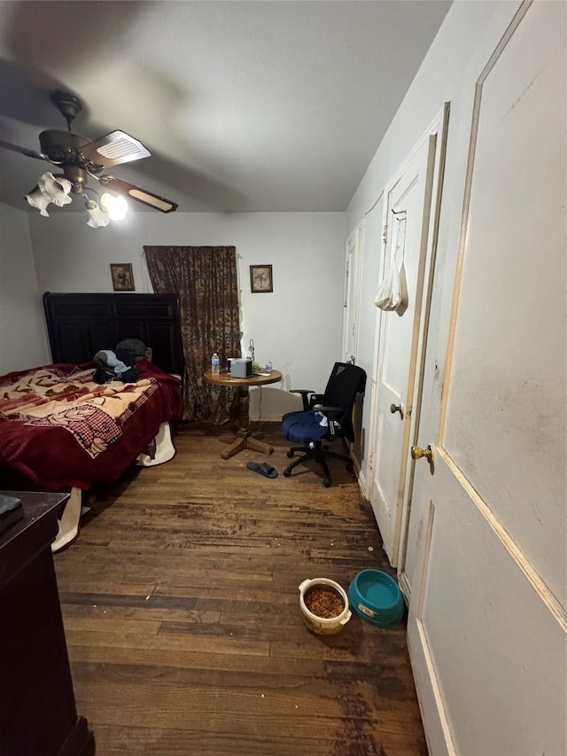 bedroom featuring ceiling fan and dark hardwood / wood-style flooring