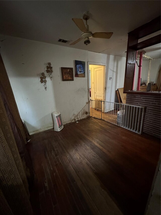 empty room featuring ceiling fan and hardwood / wood-style floors