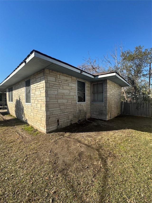 view of side of property with fence