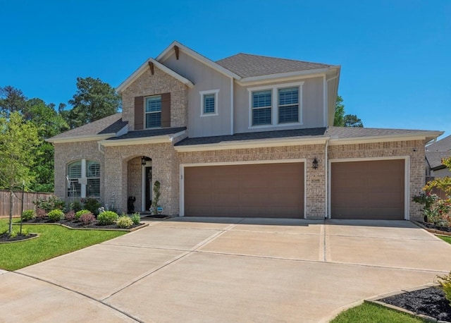 view of front of property with a garage