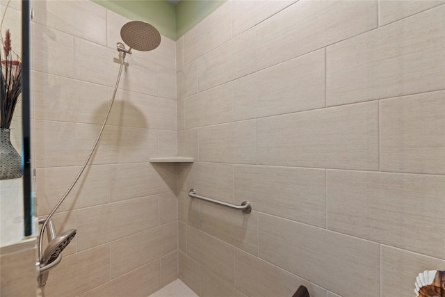 bathroom with a tile shower