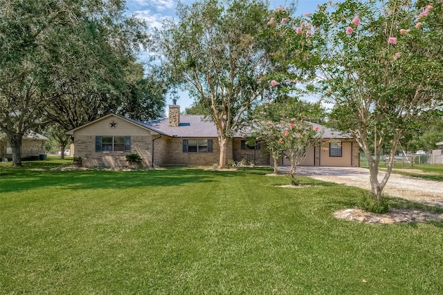 single story home featuring a front yard