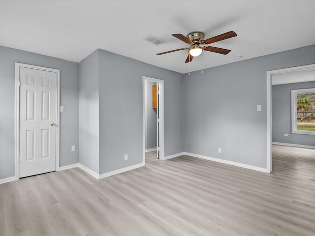 spare room with light hardwood / wood-style floors and ceiling fan